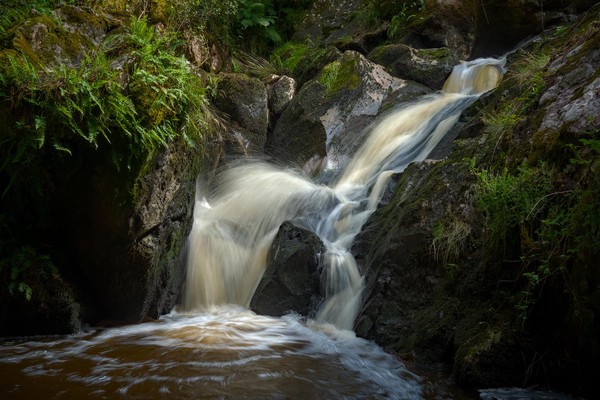 A magnificent natural waterfall in Creuse, France.
